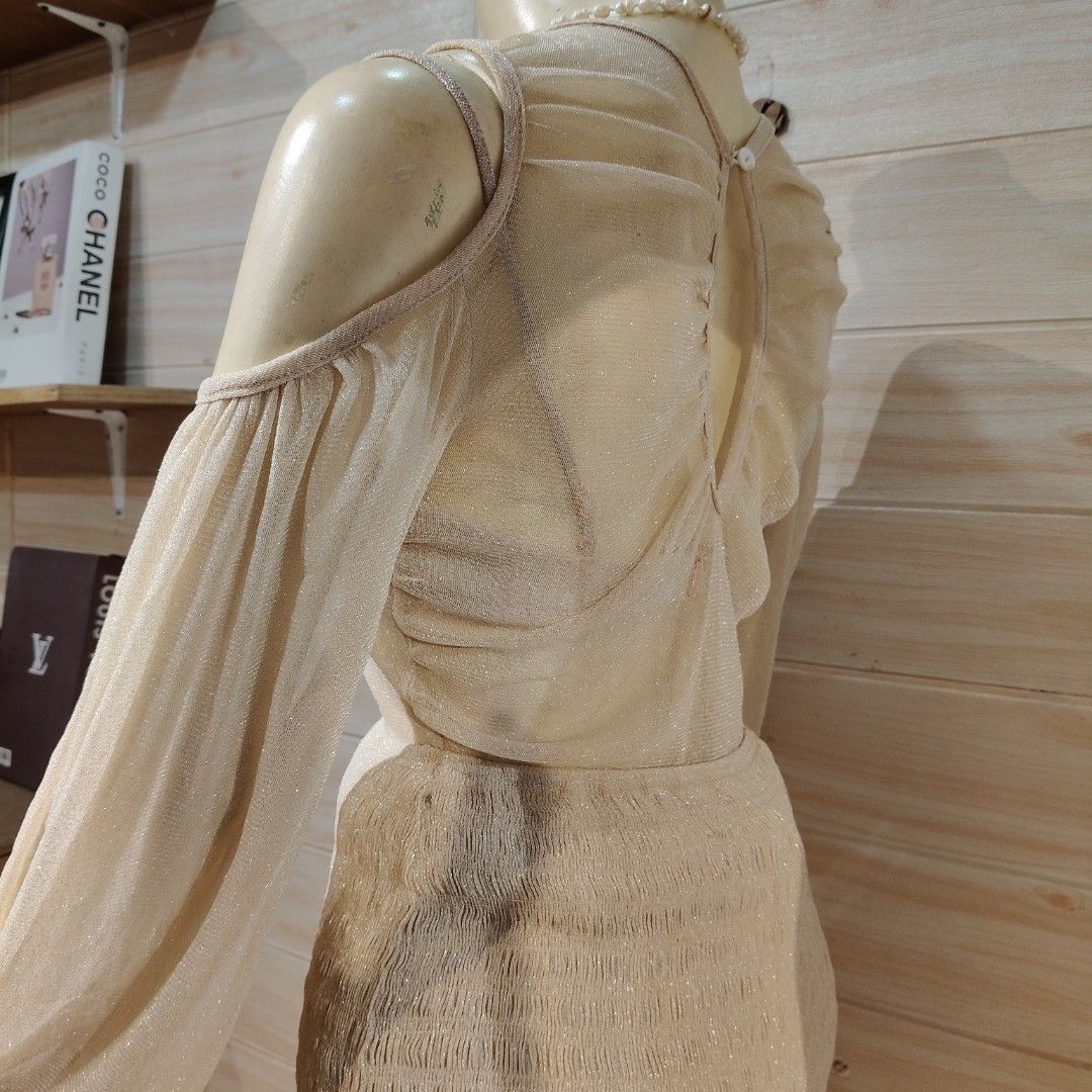 Cream Shimmer Cold Shoulder Two-Piece Set EUC (Category: Sets or Coordinates) located in Bulacan. Submitted by alyssarys (Listing ID 1467356774, Image 2). Description: - Style: Cream shimmer two-piece outfit (cold-shoulder long sleeve top and matching ruched skirt with ruffled hem) - Inclusions: Comes with an inner brassiere - Material: Mesh cotton, highly stretchable - Size: Fits Medium to Extra Large (M-XL) - Note: Please rewash before use.
