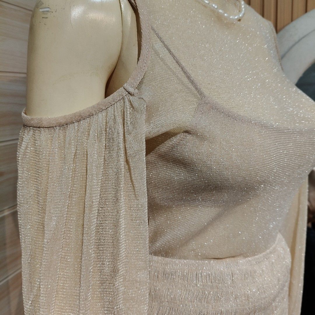 Cream Shimmer Cold Shoulder Two-Piece Set EUC (Category: Sets or Coordinates) located in Bulacan. Submitted by alyssarys (Listing ID 1467356774, Image 3). Description: - Style: Cream shimmer two-piece outfit (cold-shoulder long sleeve top and matching ruched skirt with ruffled hem) - Inclusions: Comes with an inner brassiere - Material: Mesh cotton, highly stretchable - Size: Fits Medium to Extra Large (M-XL) - Note: Please rewash before use.