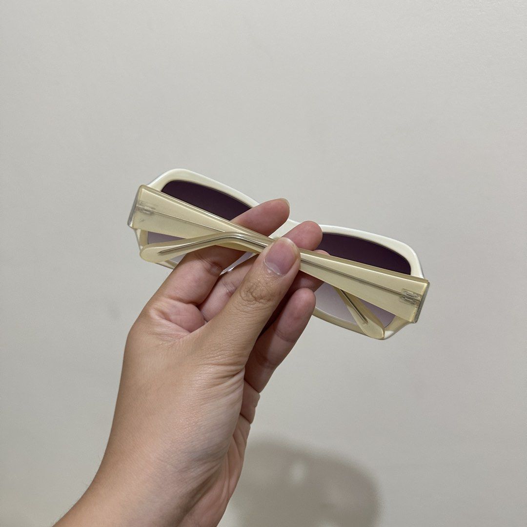 Cream White Rectangular Sunglasses with Gradient Lenses (Category: Sunglasses & Eyewear) located in Bulacan. Submitted by enne_123 (Listing ID 1467299123, Image 2). Description: - Cream white thick acetate frames in a trendy rectangular shape - Gradient dark purple-brown lenses for a stylish look - Matching cream arms featuring clean hinge details - Lightweight construction designed for comfortable daily wear - Ships immediately.