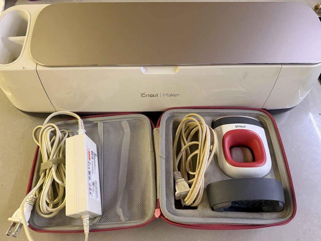 Cricut Maker Cutting Machine + Cricut Iron Press Mini (120v) + some accessories (Category: Craft Supplies & Tools) located in Manila. Submitted by bellashome (Listing ID 1467208200, Image 1). Description: - Cricut Maker machine bundle, fully tested and 100% functional - Includes power adapter, pink carrying case, rotary blade, scoring wheel, extra tips, and weeding tools - Clean cutting mat areas and changed new rubber roller part - Normal minor 