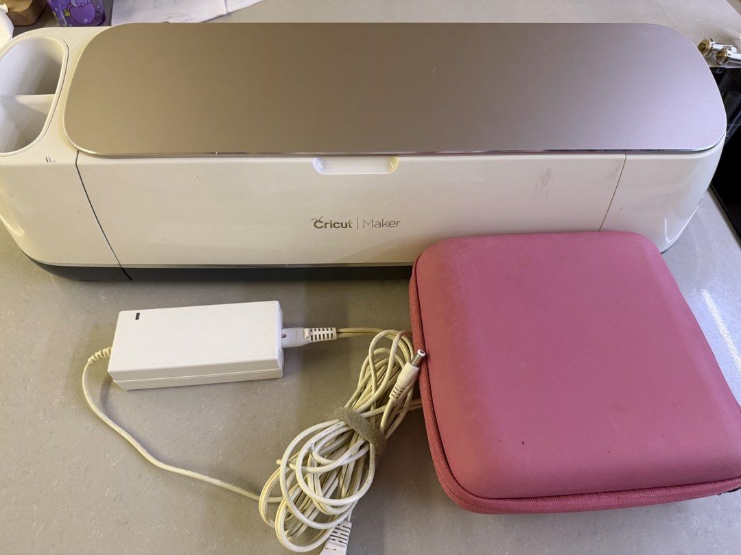 Cricut Maker Cutting Machine + Cricut Iron Press Mini (120v) + some accessories (Category: Craft Supplies & Tools) located in Manila. Submitted by bellashome (Listing ID 1467208200, Image 2). Description: - Cricut Maker machine bundle, fully tested and 100% functional - Includes power adapter, pink carrying case, rotary blade, scoring wheel, extra tips, and weeding tools - Clean cutting mat areas and changed new rubber roller part - Normal minor 