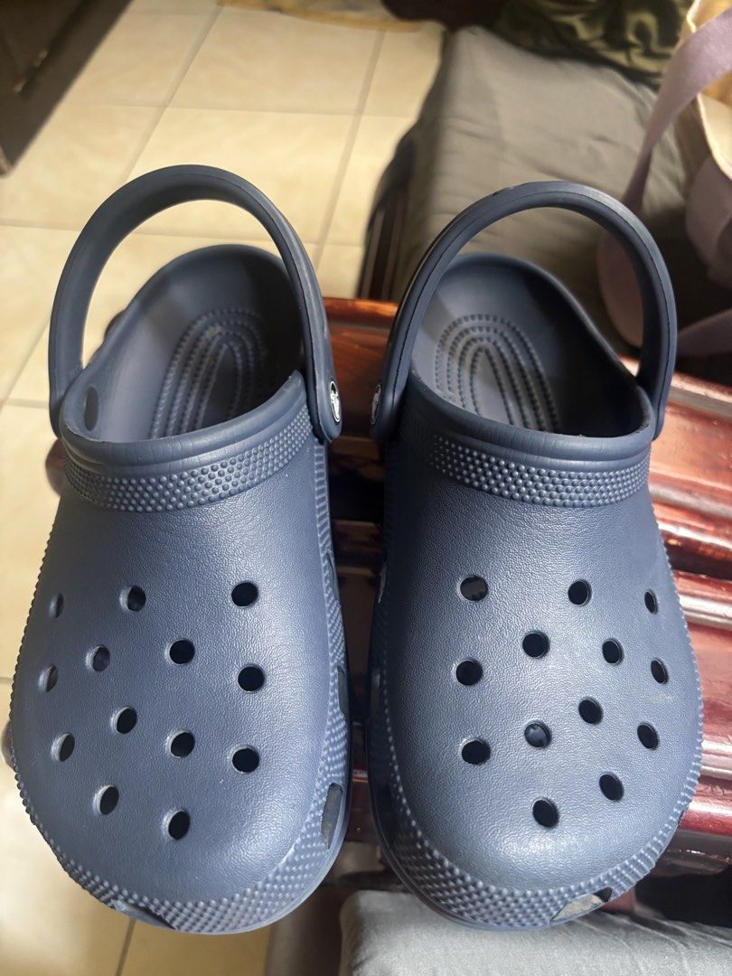 Crocs Classic Clog Navy M4W6 (Category: Slippers & Slides) located in Antipolo. Submitted by jennibee (Listing ID 1467201375, Image 1). Description: - Item: Navy blue Crocs Classic Clogs - Size: M4 / W6 - Source: Bought directly from the Crocs official online store - Features: Iconic ventilation ports, secure heel straps, and lightweight foam construction - Condition: Worn a few times with slight scuff marks on the soles, but overall plenty of li