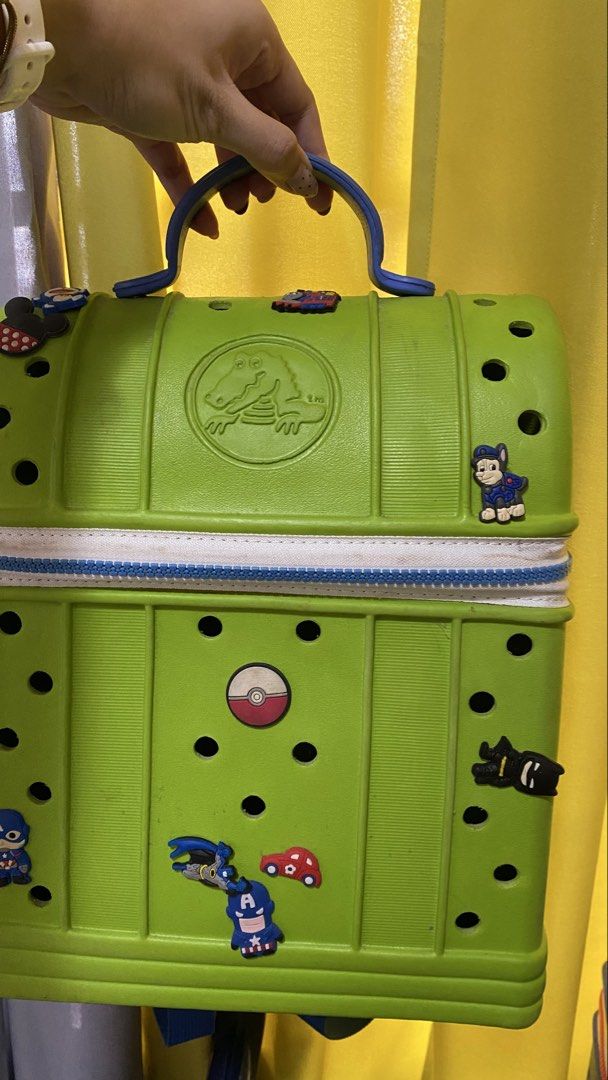 (Bundle) 2 Crocs Novelty Backpack Green and Blue Kids Bag (Category: Babies & Kids Fashion) located in Pagadian. Submitted by preowneditems01 (Listing ID 1467169115, Image 1). Description: - crocs backpack with iconic shoe sole base - Secure zip closure around the middle (functional) - Adjustable shoulder straps for a comfortable fit - Perfect unique bag for school, travel, or casual outings - bundle .