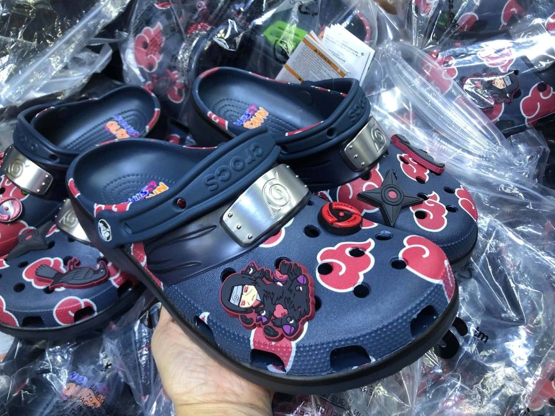 Crocs Peanuts Snoopy Charlie Brown White Clogs (Category: Slippers & Slides) located in Manila. Submitted by onlineshopmate (Listing ID 1467177656, Image 3). Description: - Brand new with green tag attached - Authentic Crocs covered in classic Peanuts comic strip prints (Snoopy, Charlie Brown & gang) - Features a contrasting red heel strap with raised 'PEANUTS' text in white - Comes with multiple character Jibbitz charms already attached - Super 