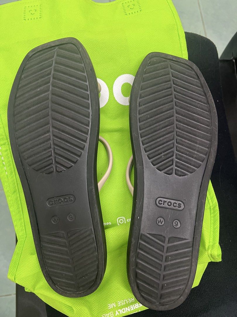 Crocs Sandals Black Women Size 9 (Category: Sandals) located in Quezon City. Submitted by aricango (Listing ID 1467360793, Image 3). Description: Wala pa to sa Philippines!! 🇵🇭 - Brand: Crocs - Condition: almost new (worn once sa mall but big size talaga sya for me) - Size: Women's US 9 - Color: Black footbed with cream slim dual straps - Features: Square toe, textured footbed, decorative charms - Origin: Made in Vietnam RFS: wrong size.