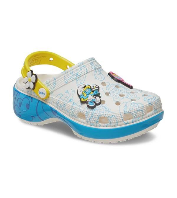 Crocs Smurfs Platform Clog White (Category: Slippers and slides) located in Manila. Submitted by lovelypreloved1497 (Listing ID 1467281153, Image 3). Description: - Brand new with original product tag still attached bought in Canada - Authentic Smurfs x Crocs platform clogs in a white base with vibrant blue character graphics - Thick blue midsole platform for extra height and comfort - Yellow heel strap featuring a cute flower Jibbitz charm - Inc