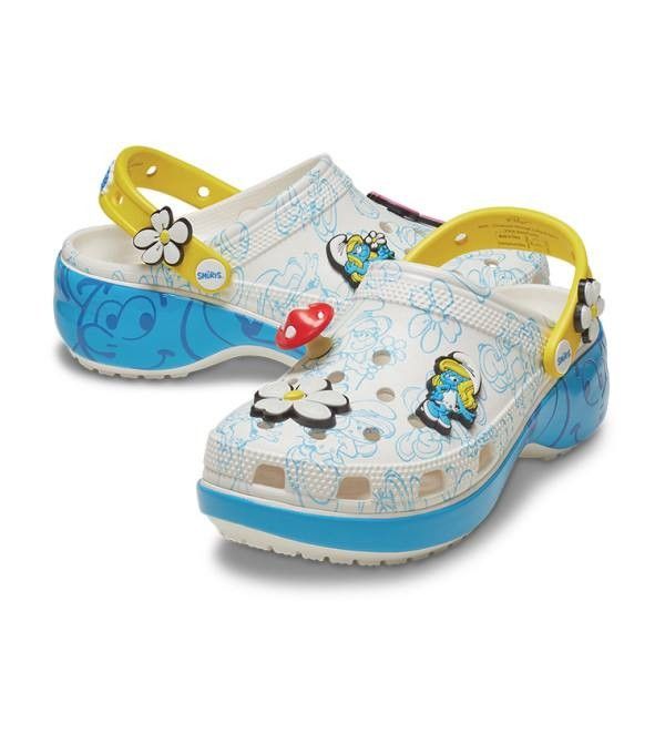 Crocs Smurfs Platform Clog White (Category: Slippers and slides) located in Manila. Submitted by lovelypreloved1497 (Listing ID 1467281153, Image 1). Description: - Brand new with original product tag still attached bought in Canada - Authentic Smurfs x Crocs platform clogs in a white base with vibrant blue character graphics - Thick blue midsole platform for extra height and comfort - Yellow heel strap featuring a cute flower Jibbitz charm - Inc