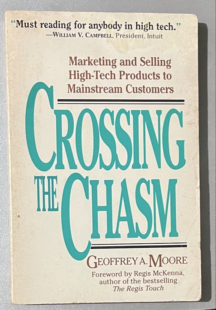 Crossing the Chasm by Geoffrey A. Moore (Category: Storybooks) located in Pasig City. Submitted by coolbreeze872 (Listing ID 1467309173, Image 1). Description: - Title: Crossing the Chasm by Geoffrey A. Moore - Foreword by Regis McKenna - Format: Paperback edition - Condition: Some cover wear and yellowing due to shelf life, content is fully readable - Ideal for: Tech startup founders, marketers, and product managers .