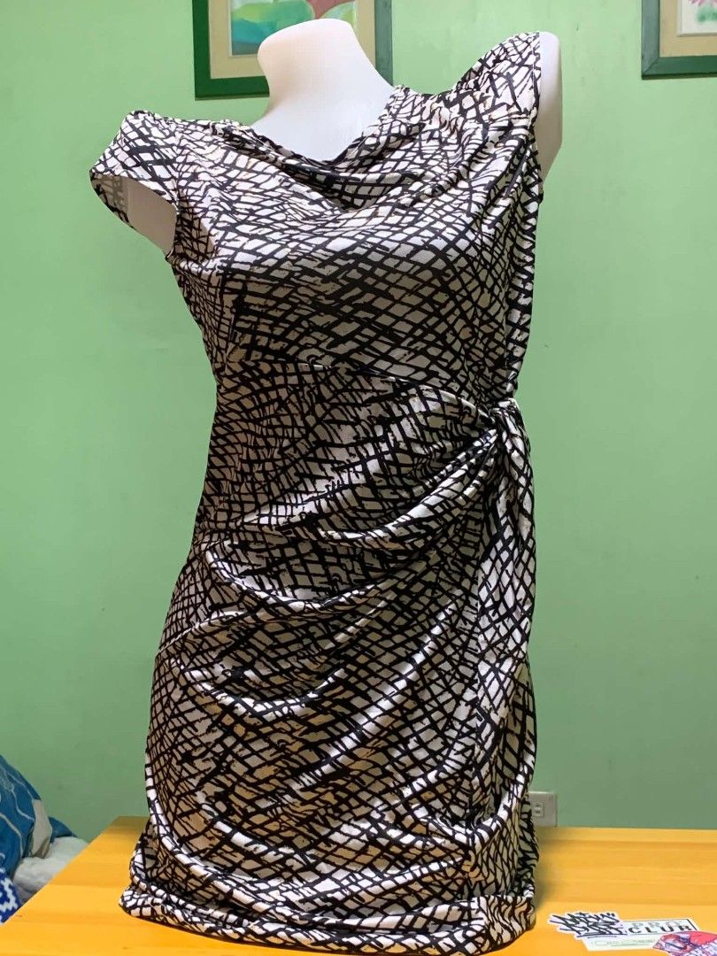 CT Spring Black White Grid Pattern Dress Size S (Category: Dresses) located in Manila. Submitted by quishi061210 (Listing ID 1467202558, Image 2). Description: - Brand: CT - Style: Spring dress in a trendy black and white grid pattern - Size: S - Design: Short cap sleeves with an elegant draped cowl neckline - Fit: Side gathered knot detail that beautifully shapes the skirt - Material: Smooth and stretchy fabric for all-day comfort.