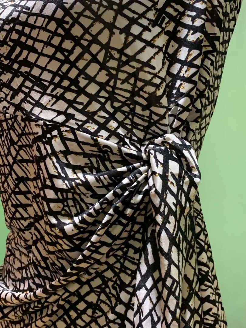 CT Spring Black White Grid Pattern Dress Size S (Category: Dresses) located in Manila. Submitted by quishi061210 (Listing ID 1467202558, Image 3). Description: - Brand: CT - Style: Spring dress in a trendy black and white grid pattern - Size: S - Design: Short cap sleeves with an elegant draped cowl neckline - Fit: Side gathered knot detail that beautifully shapes the skirt - Material: Smooth and stretchy fabric for all-day comfort.