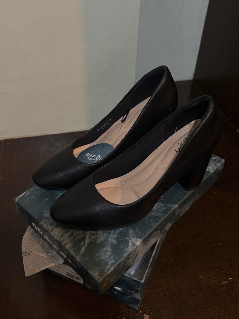 Cushion Alberto Black Heels Size 39 (Category: Heels) located in Manila. Submitted by matchavanilla_xx (Listing ID 1467280211, Image 1). Description: - Brand: Cushion Alberto - Size: 39 - Style: Chunky block heels with rounded toe - Comfort: Interior cushioned insoles for extra comfort - Condition: Brand new with tags still attached (has minor white specs on toe area, likely dust/chalk that can be cleaned) - Inclusions: Original marble-design box