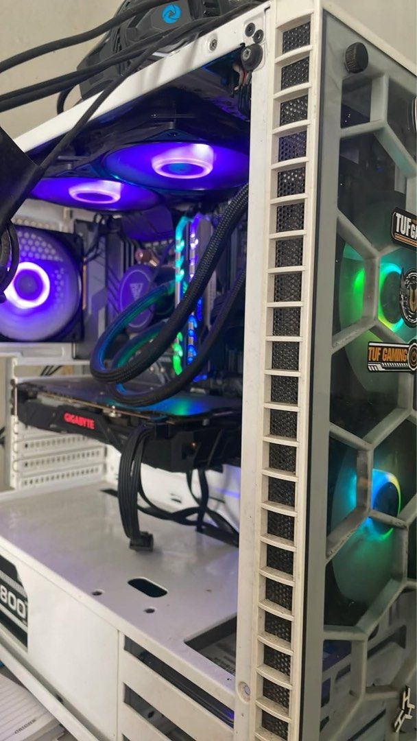 Custom Gaming PC SET (Category: Desktops) located in Manila. Submitted by rawpellicule (Listing ID 1467356341, Image 1). Description: - OS: Windows 10 Home - Processor: AMD Ryzen 5 2600 - Graphics: NVIDIA GeForce GTX 1070 (8GB VRAM) - Memory: 16GB RAM - Storage: 120GB SanDisk SSD + 1TB Western Digital HDD - Aesthetics: White case with vibrant RGB fans and liquid cooling - Condition: Gamer-ready and fully set up Issue: Monitor has slight blue line