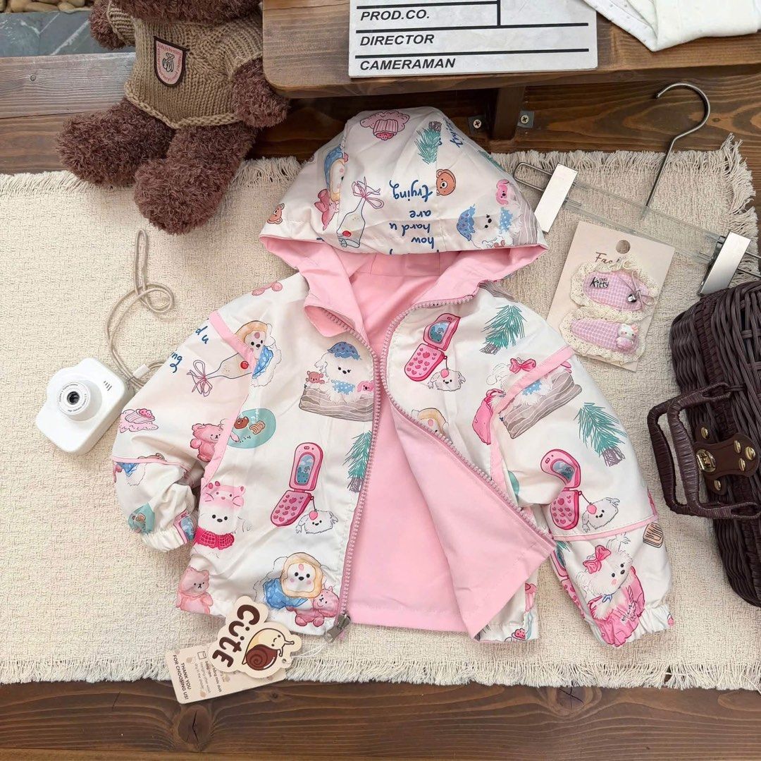 Cute Reversible Pink Kids Jacket With Hood (Category: Babies & Kids Fashion) located in Quezon City. Submitted by ad.kloset (Listing ID 1467215722, Image 1). Description: - Brand new with tag attached - Fully reversible design (pink or playful animal pattern) - Features a matching hood and full front zipper - Versatile everyday outerwear for kids - Sizes available: 100 to 150 (fits ages 1 to 7 years old).