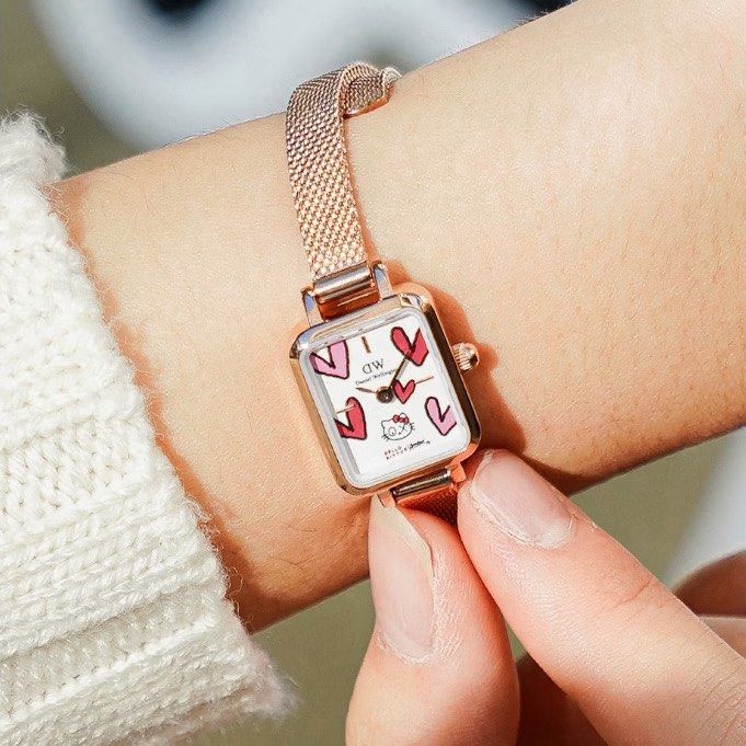 Daniel Wellington x Hello Kitty x Andre Watch (Category: Women's Watches) located in Manila. Submitted by janetecson05 (Listing ID 1467203467, Image 2). Description: - Brand new in box: Daniel Wellington x Kitty collaboration watch with Andre artwork - Elegant rose gold finish with a unique square dial - Features cute heart illustrations and iconic Kitty graphics - Stylish and comfortable mesh strap - Complete set: Includes a special edition red 