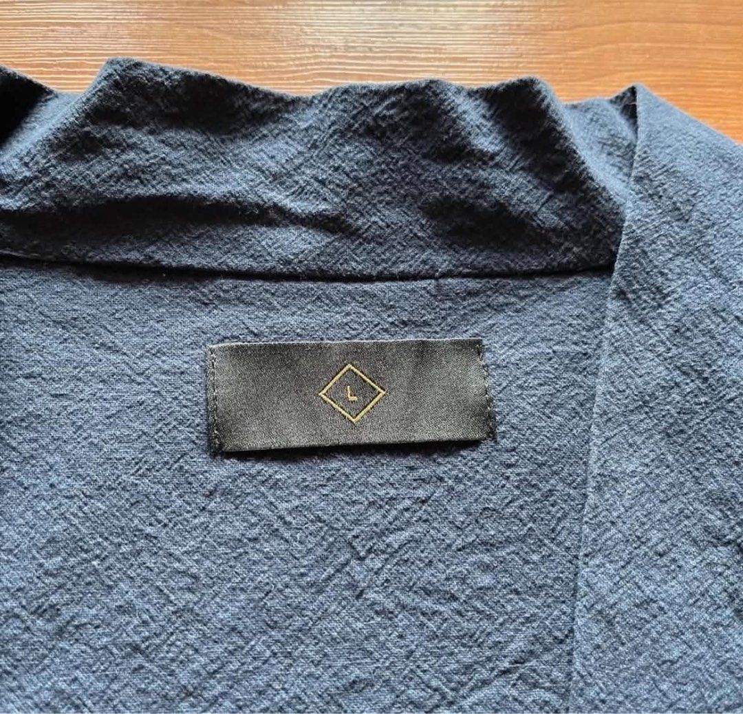 Dark Blue Kimono (Category: Tshirts & Polo Shirts ) located in Rizal. Submitted by timelessfinds89_ (Listing ID 1467317656, Image 3). Description: - Color & Style: Dark blue oversized kimono cardigan - Size: L (Tag attached) - Material: 95% cotton, 5% spandex (textured fabric) - Features: Open front style with front pockets and button details - Care Instructions: Hand wash only, do not tumble dry, low iron Condition : good condish Size : Large Di