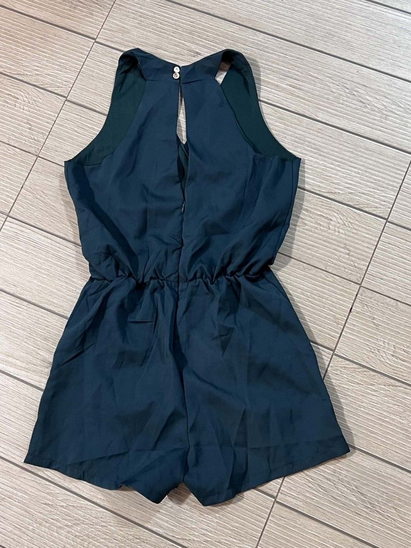 Dark Green V-Neck Halter Romper (Category: Rompers) located in San Jose del Monte. Submitted by Skin_Care2022 (Listing ID 1467259316, Image 3). Description: - Color: Dark Green - Style: Halter neckline with crossover V-neck front - Features: Built-in shorts, convenient side pockets, and keyhole cutout detail in the back - Closure: Secure back zipper and two small back buttons - Condition: Clean, excellent, and ready to wear - Versatility: Ideal f