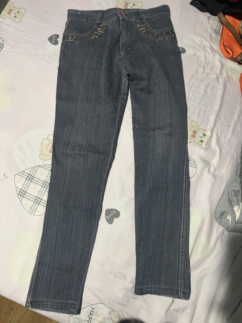 Dark grey striped denim jeans size 31 (Category: Jeans) located in Manila. Submitted by mcllts (Listing ID 1467349097, Image 1). Description: - Dark grey denim jeans with subtle vertical stripes - Size 31 tag attached near the waistband - Distinctive zigzag contrast stitching on the front pockets - Classic straight cut leg design - Convenient button fly closure - Great everyday casual pants that match easily with t-shirts and jackets.