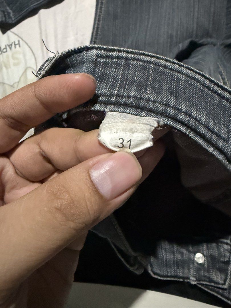 Dark grey striped denim jeans size 31 (Category: Jeans) located in Manila. Submitted by mcllts (Listing ID 1467349097, Image 2). Description: - Dark grey denim jeans with subtle vertical stripes - Size 31 tag attached near the waistband - Distinctive zigzag contrast stitching on the front pockets - Classic straight cut leg design - Convenient button fly closure - Great everyday casual pants that match easily with t-shirts and jackets.