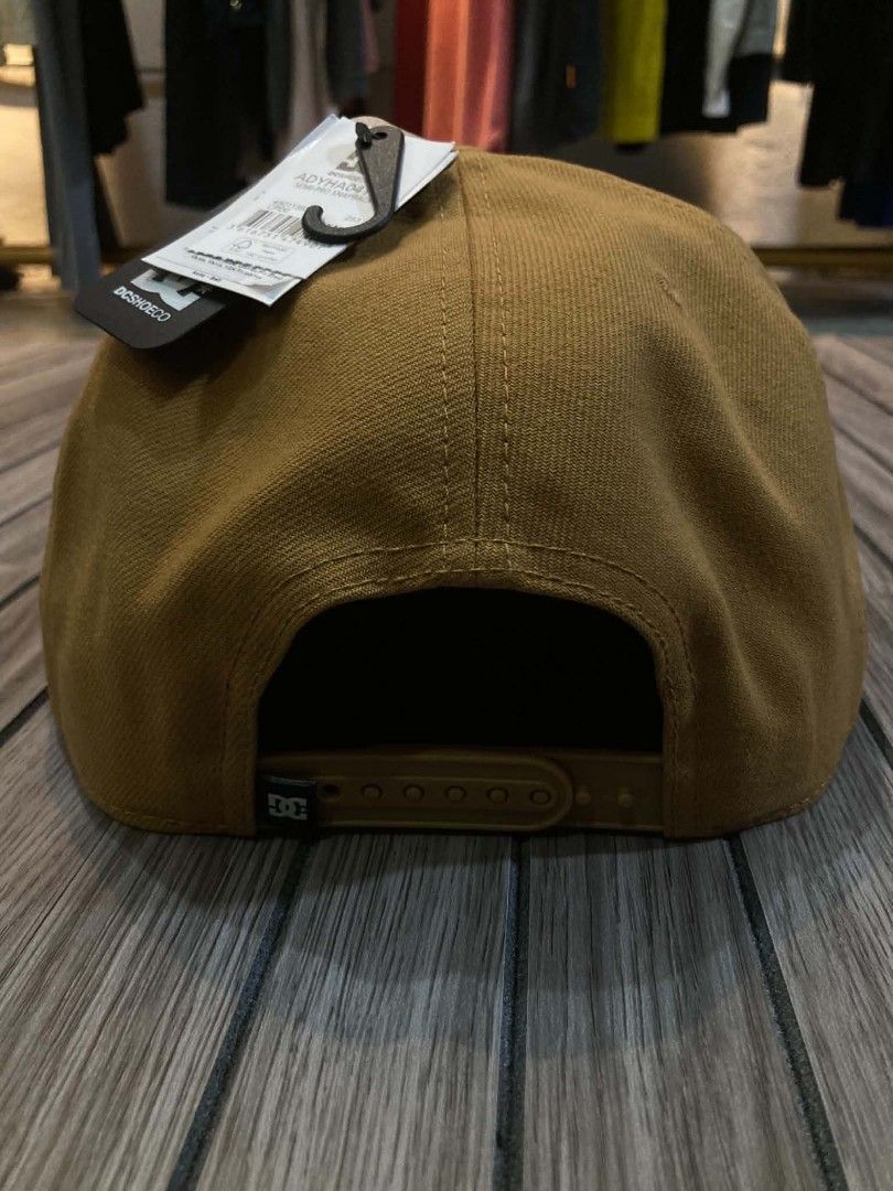 DC Shoes Adyha04170 Semi-Pro Snapback Cap Wheat Brown (Category: Caps & Hats) located in Trece Martires City. Submitted by djaothriftshop (Listing ID 1467293214, Image 3). Description: - Brand: DC Shoes - Style: Snapback cap with structured crown and flat brim - Color: Wheat brown - Details: Embroidered front logo and '94' embroidery on the side - Closure: Adjustable plastic snapback - Condition: Brand new with tags attached - Size: One size fits