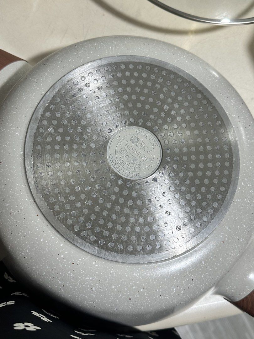 Dessini Granite Divided Hot Pot with Glass Lid (Category: Cookware & Accessories) located in Manila. Submitted by harpo20 (Listing ID 1467355481, Image 3). Description: - Dual-sided divider: Cook two different broths simultaneously - Stylish design: Modern grey speckled finish with chic wood-look handles and knob - Includes clear glass lid to easily monitor your cooking - Induction-compatible bottom plate works on all stove types - Condition: Cle