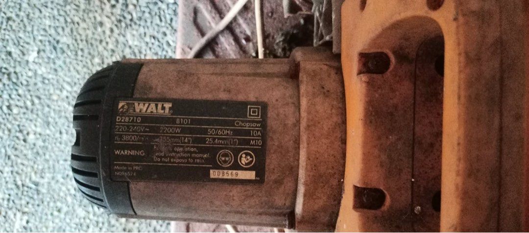 Dewalt Chopsaw (Category: Construction Tools & Equipment) located in Manila. Submitted by rawpellicule (Listing ID 1467356306, Image 2). Description: - Brand: Dewalt - Model: D28710 (Serial No. 008569) - Type: 14-inch Heavy-Duty Chop Saw / Metal Cutter - Power: 2200W, 220-240V - Motor Speed: 3800 RPM - Origin: Made in PRC - Condition: Fully working condition. Shows workshop dust, dirt buildup, and rust on the heavy metal base from use. Needs clea
