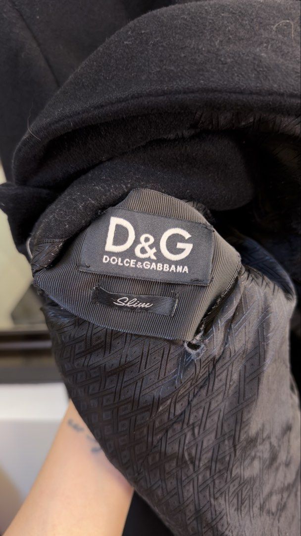 D&G Dolce & Gabbana Crest Patch Slim Blazer Black (Category: Coats, Jackets and Outerwear) located in Paranaque City. Submitted by mykapoynton (Listing ID 1467241143, Image 3). Description: D&G Dolce & Gabbana Crest Patch Slim Blazer Black - Features a stylish embroidered crest patch on the chest pocket - Elegant patterned inner lining with structured shoulders and lapel collar - Two-button front closure for a sharp, tailored silhouette - Versati