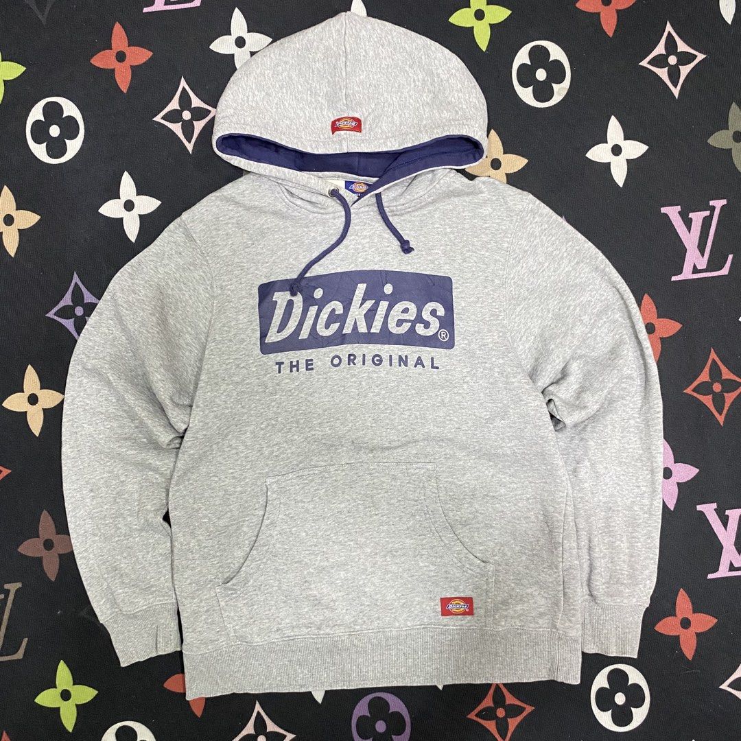 Dickies Grey Original Logo Hoodie Medium (Category: Hoodies) located in Loreto, Surigao del Norte. Submitted by ongcollection_747 (Listing ID 1467331846, Image 1). Description: - Brand: Dickies - Size: Medium - Color: Grey with purple accents (hood lining and drawstrings) - Design: Big 'The Original' logo graphic on the chest + small woven patch on the kangaroo pocket - Material: Comfortable cotton and polyester fleece blend - Features: Front kan