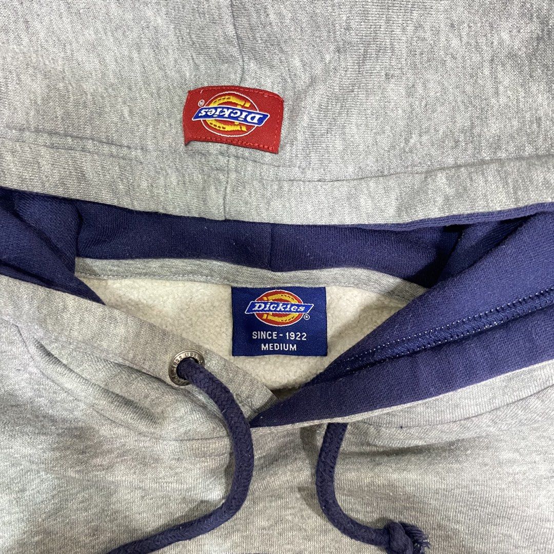 Dickies Grey Original Logo Hoodie Medium (Category: Hoodies) located in Loreto, Surigao del Norte. Submitted by ongcollection_747 (Listing ID 1467331846, Image 2). Description: - Brand: Dickies - Size: Medium - Color: Grey with purple accents (hood lining and drawstrings) - Design: Big 'The Original' logo graphic on the chest + small woven patch on the kangaroo pocket - Material: Comfortable cotton and polyester fleece blend - Features: Front kan