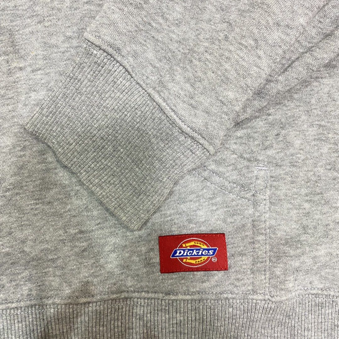 Dickies Grey Original Logo Hoodie Medium (Category: Hoodies) located in Loreto, Surigao del Norte. Submitted by ongcollection_747 (Listing ID 1467331846, Image 3). Description: - Brand: Dickies - Size: Medium - Color: Grey with purple accents (hood lining and drawstrings) - Design: Big 'The Original' logo graphic on the chest + small woven patch on the kangaroo pocket - Material: Comfortable cotton and polyester fleece blend - Features: Front kan