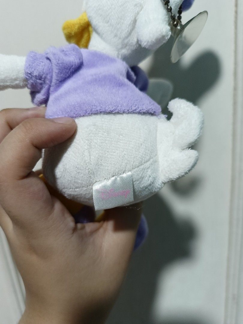 Disney Daisy Duck Plush Toy keychain (Category: Plushies & Soft Toys) located in Pasig City. Submitted by sleepyfairy (Listing ID 1467353824, Image 3). Description: - Official Disney Daisy Duck - Equipped with a bead chain and suction cup for hanging or sticking on glass message me if you have questions about the item 🫶🏻 shipping fee shouldered by buyer 🩷.
