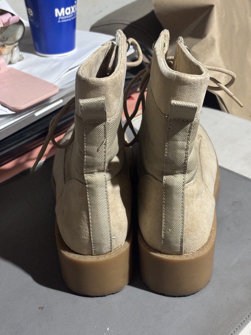 Divided by H&M Beige Combat Boots Size US 7 (Category: Boots) located in Manila. Submitted by andy031602 (Listing ID 1467327684, Image 3). Description: - Brand: Divided by H&M - Style: Tan combat boots with chunky rubber soles and a slight heel - Material: Suede-like finish with breathable fabric side panels - Details: Lace-up front with metal eyelets/hooks and a back pull tab - Size: EUR 38 / US 7.
