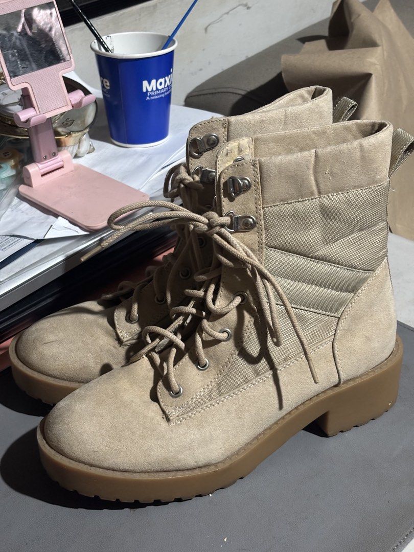 Divided by H&M Beige Combat Boots Size US 7 (Category: Boots) located in Manila. Submitted by andy031602 (Listing ID 1467327684, Image 2). Description: - Brand: Divided by H&M - Style: Tan combat boots with chunky rubber soles and a slight heel - Material: Suede-like finish with breathable fabric side panels - Details: Lace-up front with metal eyelets/hooks and a back pull tab - Size: EUR 38 / US 7.