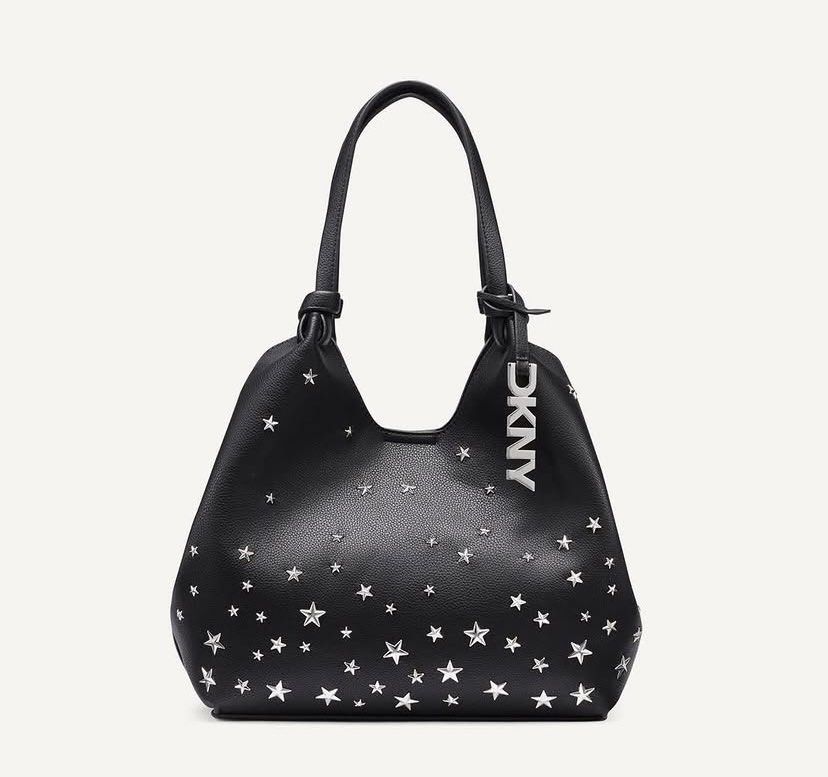 DKNY Paula Star (Category: Luxury Bags & Wallets) located in Muntinlupa City. Submitted by mabelleadr46801 (Listing ID 1467274170, Image 3). Description: Fresh from 🇨🇦 🍁 DKNY Paula Star-Embellished Tote (or similar star-studded commuter tote) in black or dark blue with silver-tone star studs. Key Features • Brand: DKNY (Donna Karan New York) • Design: Slouchy tote silhouette with double shoulder/top handles and scattered silver star embellishm