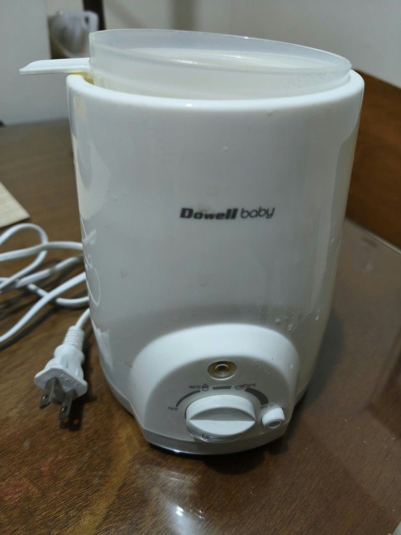 Dowell Baby Bottle Warmer (Category: Breastfeeding & Bottle Feeding) located in Quezon City. Submitted by erccasiple (Listing ID 1467320053, Image 2). Description: - Brand: Dowel - Color: White - Features adjustable temperature dial for precise warming - Includes clear plastic cover lid - Handy appliance for quick warming of milk and baby food - Standard power plug attached (PH plug) - Perfect and convenient essential for busy parents!.