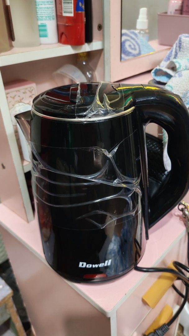 Dowell Electric Kettle EK-170 1.7L Black (Category: Kettles & Airpots) located in Manila. Submitted by lqndnm.lhen (Listing ID 1467333431, Image 2). Description: - Brand: Dowell - Model: EK-170 - Color: Sleek black finish - Capacity: 1.7L - Feature: Cool-touch double wall body for safety - Condition: Like new, protective plastic film still wrapped around the body - Packaging: Original box included.