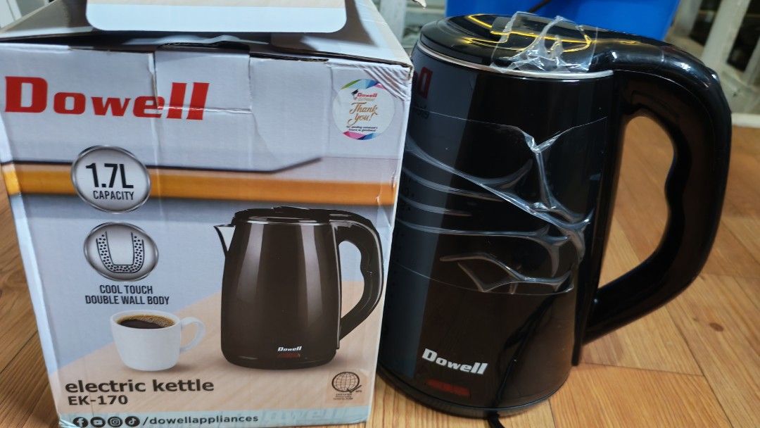 Dowell Electric Kettle EK-170 1.7L Black (Category: Kettles & Airpots) located in Manila. Submitted by lqndnm.lhen (Listing ID 1467333431, Image 1). Description: - Brand: Dowell - Model: EK-170 - Color: Sleek black finish - Capacity: 1.7L - Feature: Cool-touch double wall body for safety - Condition: Like new, protective plastic film still wrapped around the body - Packaging: Original box included.