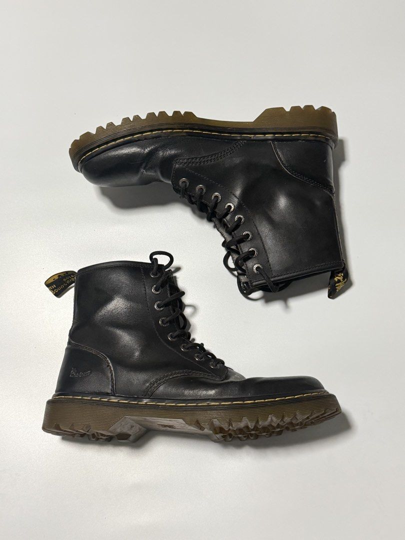 Dr. Martens Black Leather Lace-Up Boots (Category: Boots) located in Manila. Submitted by jcarchives14 (Listing ID 1467272510, Image 2). Description: - Brand: Dr. Martens - Style: Classic 8-eyelet lace-up boots - Color: Black leather - Details: Signature yellow welt stitching, chunky treaded soles, and heel loops - Condition: Minor creasing on the toe box from normal wear, sturdy construction - Perfect for: Everyday street style and all-weather w