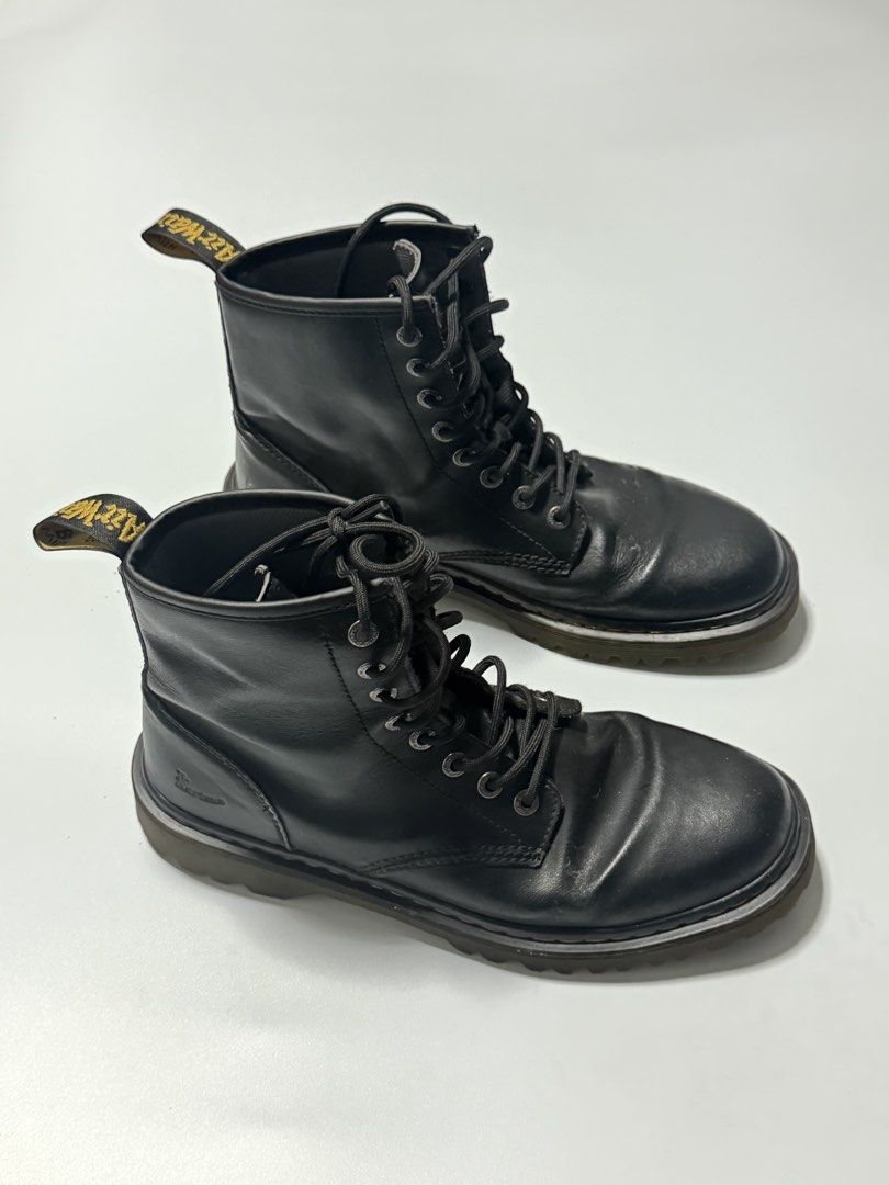 Dr. Martens Black Leather Lace-Up Boots (Category: Boots) located in Manila. Submitted by jcarchives14 (Listing ID 1467272510, Image 1). Description: - Brand: Dr. Martens - Style: Classic 8-eyelet lace-up boots - Color: Black leather - Details: Signature yellow welt stitching, chunky treaded soles, and heel loops - Condition: Minor creasing on the toe box from normal wear, sturdy construction - Perfect for: Everyday street style and all-weather w