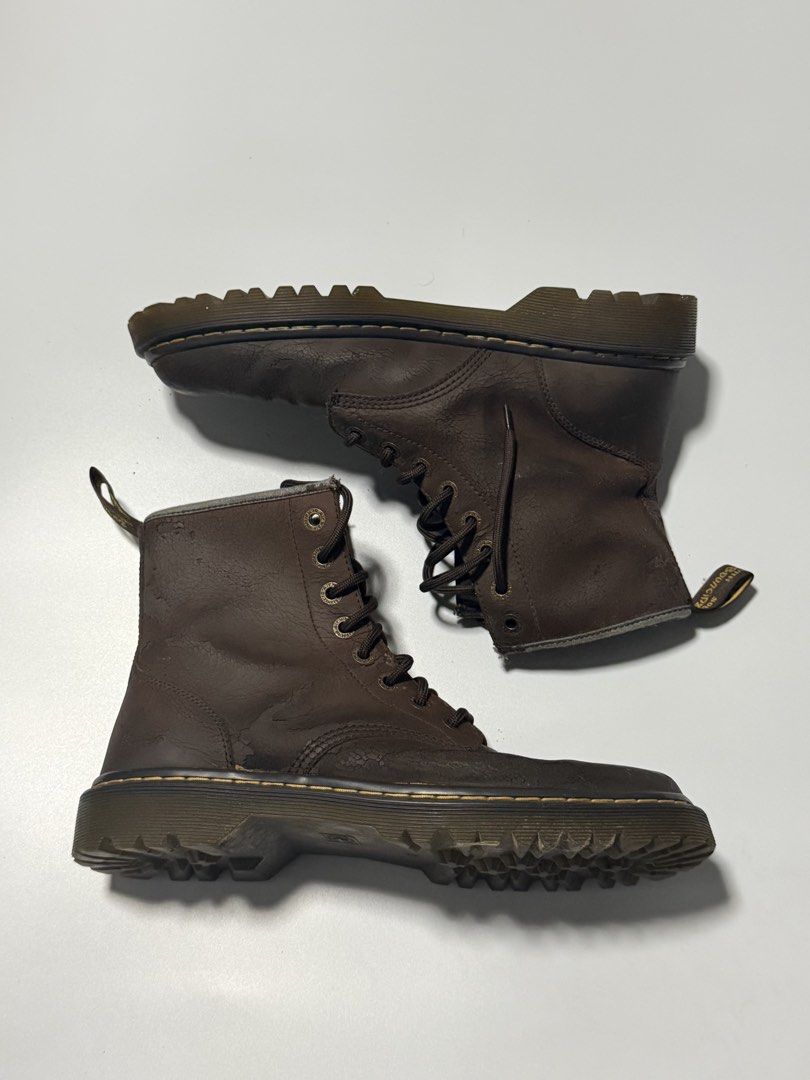 Dr. Martens Brown Leather Lace-Up Boots (Category: Boots) located in Manila. Submitted by jcarchives14 (Listing ID 1467272682, Image 2). Description: - Brand: Dr. Martens - Style: Mid-calf lace-up boots - Color: Brown with matching laces and dark eyelets - Details: Classic yellow welt stitching and signature heel pull loop - Condition: Heavily worn with noticeable cracking on the leather, especially near the toe boxes and collars.