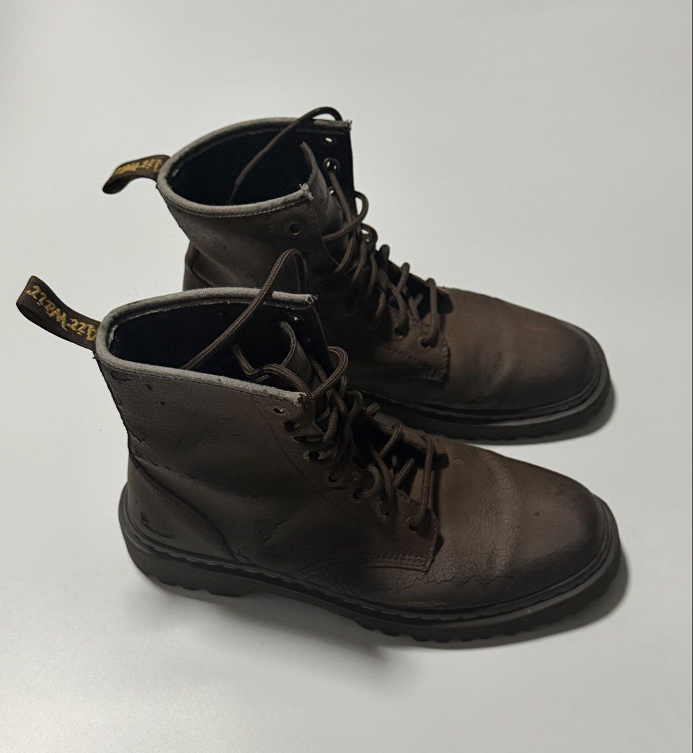 Dr. Martens Brown Leather Lace-Up Boots (Category: Boots) located in Manila. Submitted by jcarchives14 (Listing ID 1467272682, Image 1). Description: - Brand: Dr. Martens - Style: Mid-calf lace-up boots - Color: Brown with matching laces and dark eyelets - Details: Classic yellow welt stitching and signature heel pull loop - Condition: Heavily worn with noticeable cracking on the leather, especially near the toe boxes and collars.