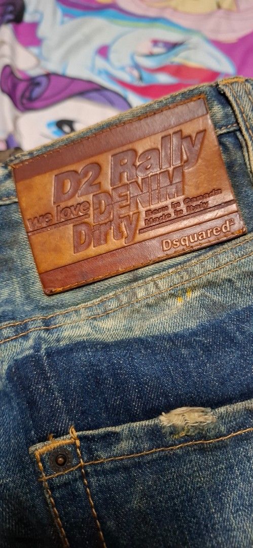 Dsquared2 D2 Rally Denim Dirty Jeans (Category: Jeans) located in Quezon City. Submitted by robertlimbao (Listing ID 1467251385, Image 1). Description: - Brand: Dsquared2 - Origin: Made in Italy Size on tag 40 In Tape Measure 16inch canfit to 32 Length is 36 inches - Wash/Treatment: Heavyweight denim with authentic vintage Distressed Dirty Jeans treatment, distressed details, and factory fading - Details: 'D2 Rally Denim Dirty' leather back patch
