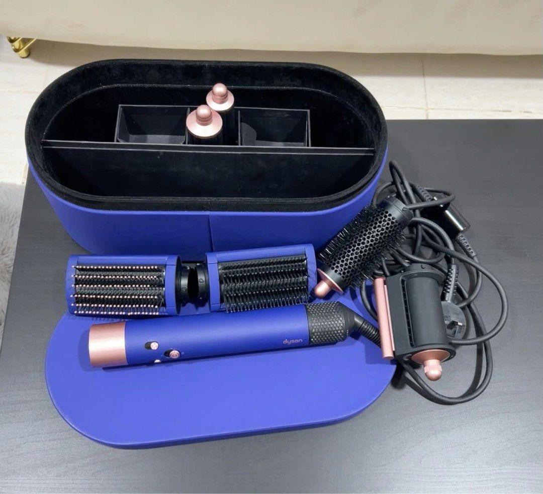 Dyson Airwrap Multi-Styler and Dyson Corrale Straightener (Category: Hair) located in Quezon City. Submitted by kelsanneee18 (Listing ID 1467246174, Image 1). Description: - Authentic Dyson hair styling set in vibrant blue and rose gold - Includes multi-styler with curling barrels, smoothing brushes, and round volumizing brush - Features cordless straightener with presentation case - Comes with all original power cords and matching storage cases 