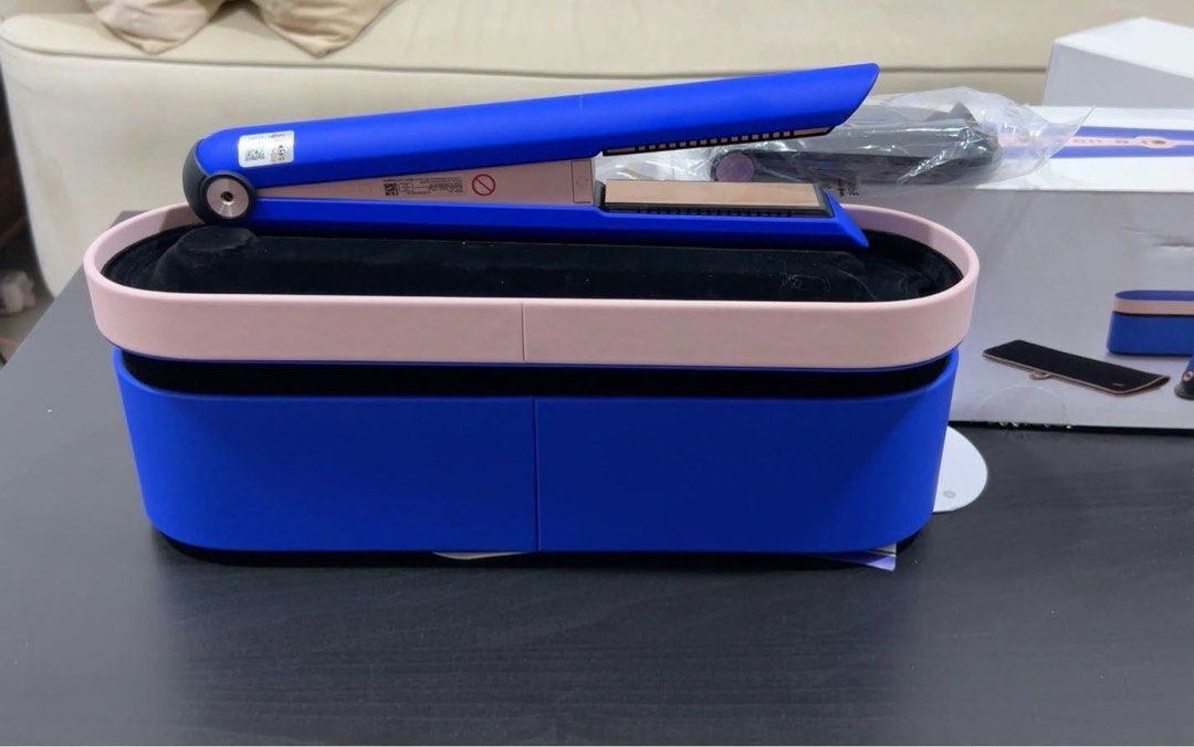 Dyson Airwrap Multi-Styler and Dyson Corrale Straightener (Category: Hair) located in Quezon City. Submitted by kelsanneee18 (Listing ID 1467246174, Image 3). Description: - Authentic Dyson hair styling set in vibrant blue and rose gold - Includes multi-styler with curling barrels, smoothing brushes, and round volumizing brush - Features cordless straightener with presentation case - Comes with all original power cords and matching storage cases 