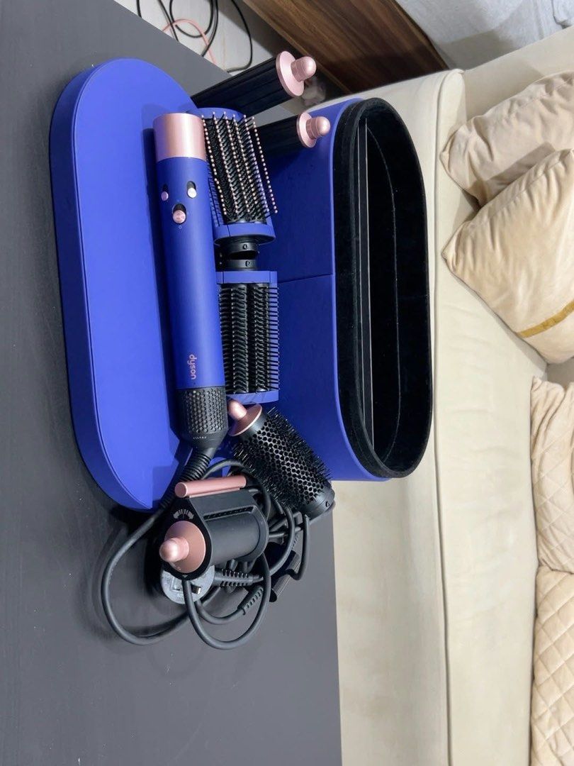 Dyson Airwrap Multi-Styler and Dyson Corrale Straightener (Category: Hair) located in Quezon City. Submitted by kelsanneee18 (Listing ID 1467246174, Image 2). Description: - Authentic Dyson hair styling set in vibrant blue and rose gold - Includes multi-styler with curling barrels, smoothing brushes, and round volumizing brush - Features cordless straightener with presentation case - Comes with all original power cords and matching storage cases 