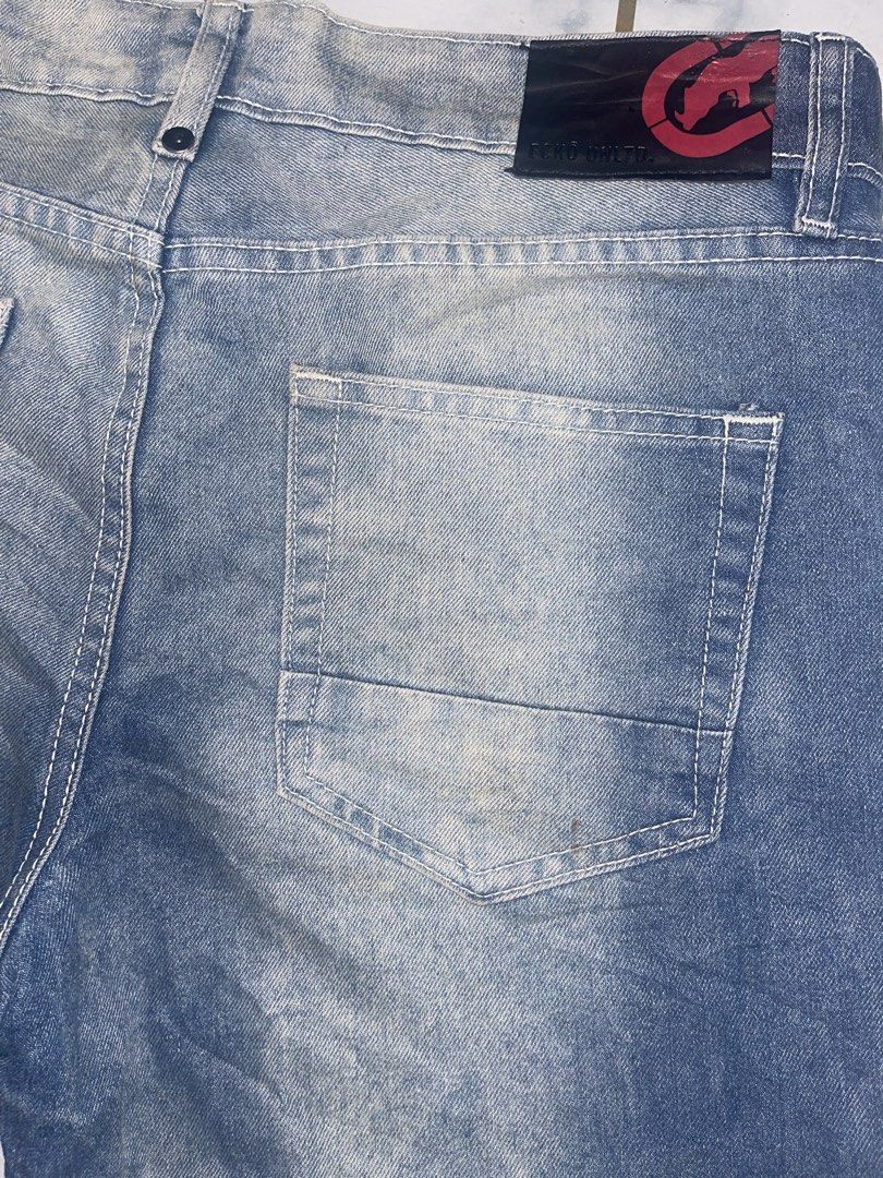 Ecko Unld. Denim Shorts Size 30 (Category: Shorts) located in Manila. Submitted by fastforest_65f95b (Listing ID 1467289565, Image 3). Description: - Brand: Ecko Unld. - Size: 30 - Color/Wash: Blue denim with acid wash finish and fading - Details: Classic five-pocket layout, white contrast stitching - Hardware: Branded metal button closure and zip fly - Branding: Small fabric logo patch on coin pocket and leather brand patch on back waistband.