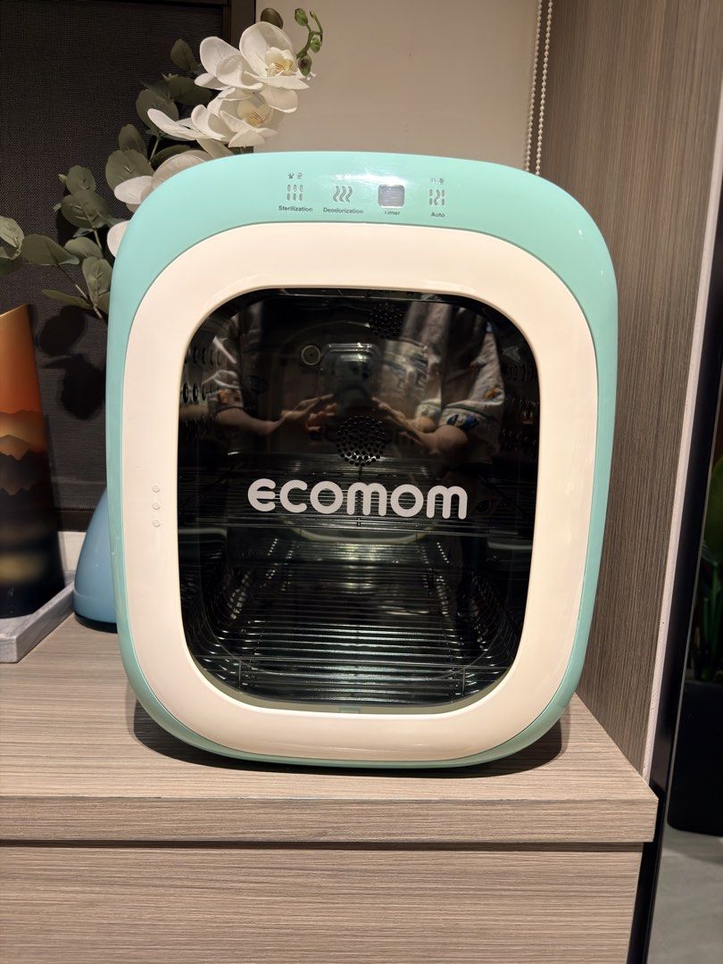 ECOMOM Single UV Sterilizer ECO-22 (Category: Breastfeeding & Bottle Feeding) located in Pasig City. Submitted by theclosetcasemanila (Listing ID 1467347397, Image 1). Description: - Brand/Model: Ecomom Baby Bottle Sterilizer (ECO-22) - Color: Mint Green and White - Functions: Sterilization, deodorization, timer, and auto modes - Interior: Stainless steel with wire racks - Specs: Made in Korea, runs on 220V - Production Date: November 2016 (indic