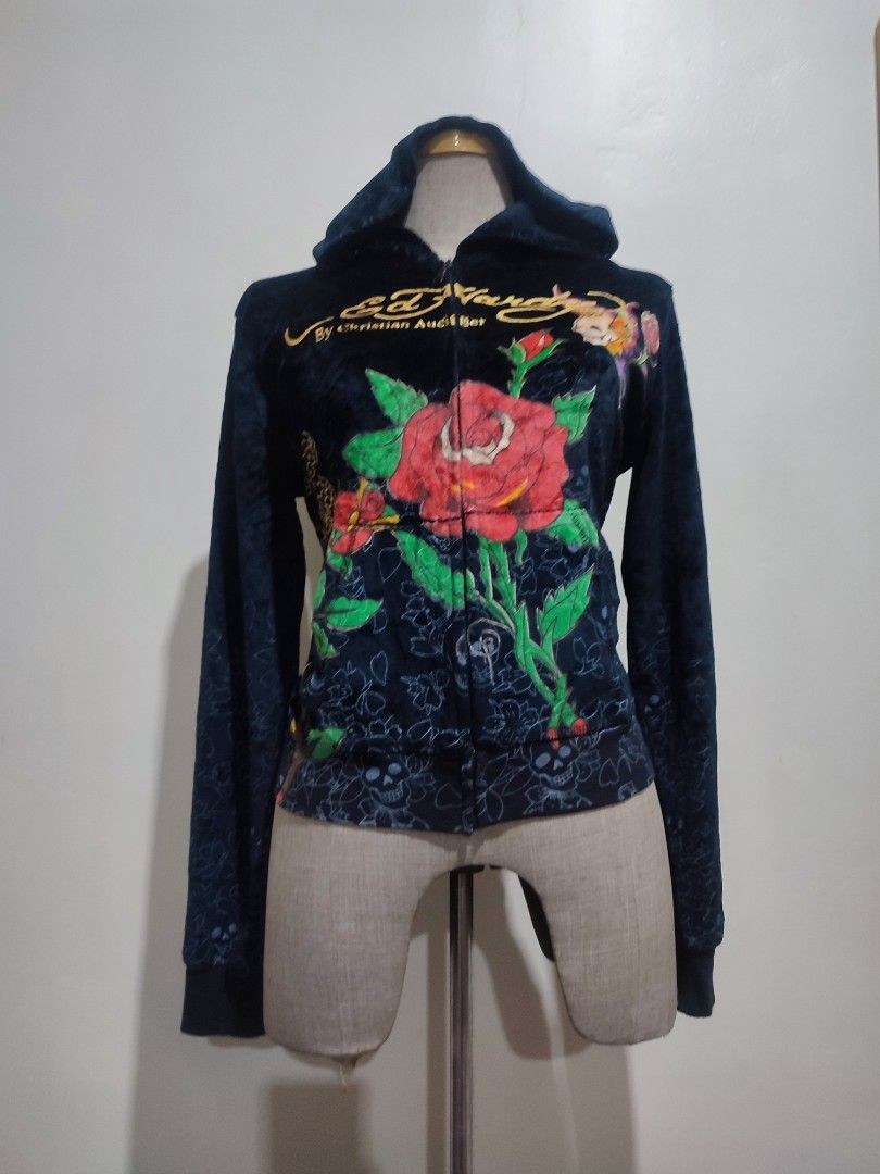 Ed Hardyee (Category: Hoodies) located in Baguio. Submitted by perrycore_27 (Listing ID 1467199626, Image 1). Description: - Brand: Ed Hardy by Christian Audigier - Style: Dark velvet zip-up hoodie - Size: Large - Front Details: Large red rose graphic with gold lettering - Back Details: Skull, heart with "LOVE KILLS SLOWLY", and butterfly graphics - Special Features: Subtle tonal skull and floral print on sleeves and lower body - Condition: Brand