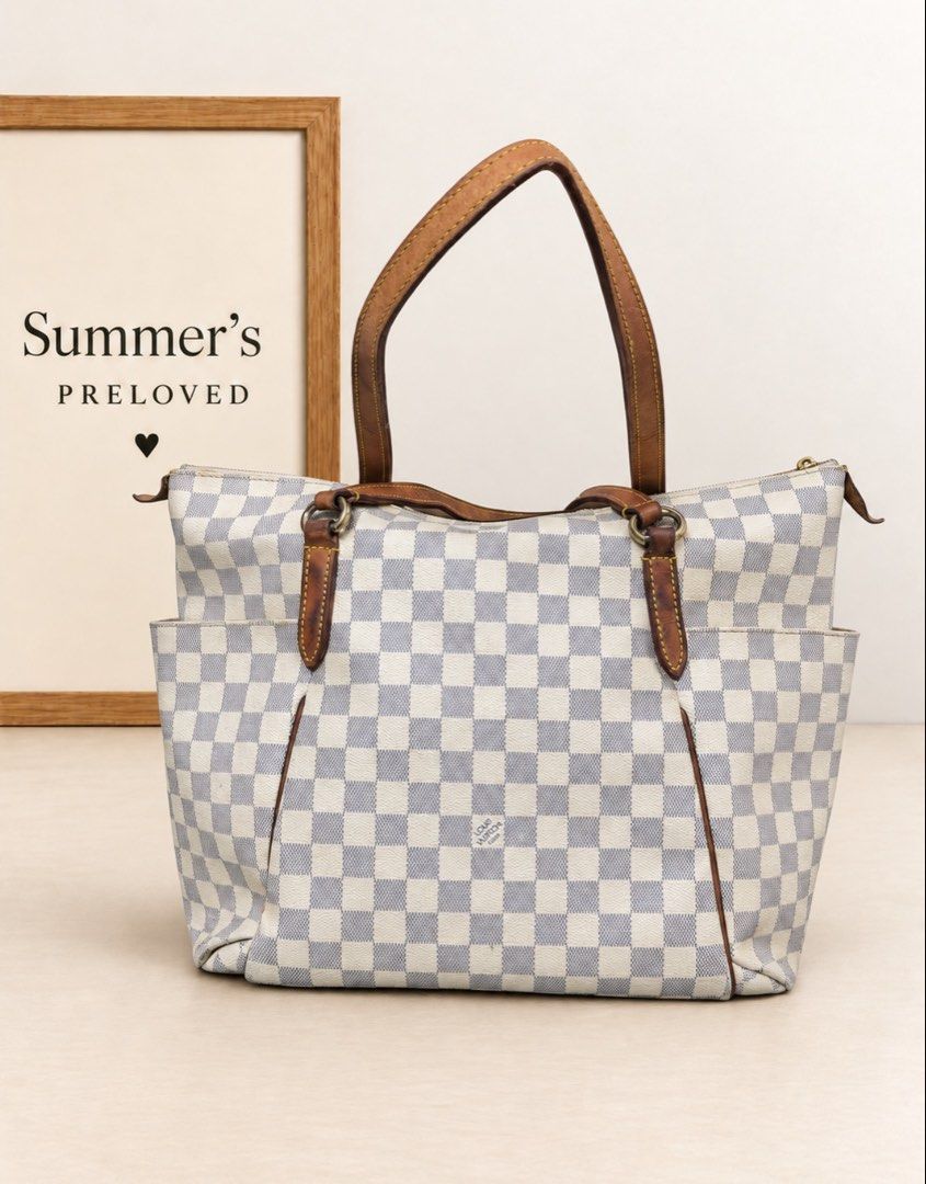 Elvira Damier Azur Tote bag (Category: Tote Bags) located in Taguig. Submitted by summers.preloved (Listing ID 1467282496, Image 1). Description: 👜 BAG DETAILS • Damier Azur coated canvas: The signature checked exterior gives this tote its recognizable look and gently textured finish. • Leather handles and trim: The design features vachetta cowhide leather, with this piece showing a deep caramel-brown patina. Contrast stitching and leather pipin