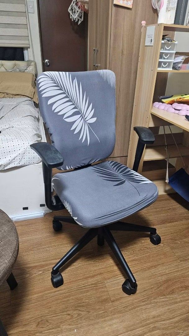Ergonomic Office Chair with Leaf Pattern Cover (Category: Office Furniture & Fixtures) located in Manila. Submitted by boldlion.613922 (Listing ID 1467194014, Image 1). Description: - Comfy grey stretch cover with stylish white and dark grey leaf print - Ergonomic design with comfortable padding for long working hours - Fully adjustable armrests for custom support - Smooth swivel function and rolling casters for easy mobility - Sturdy black base 