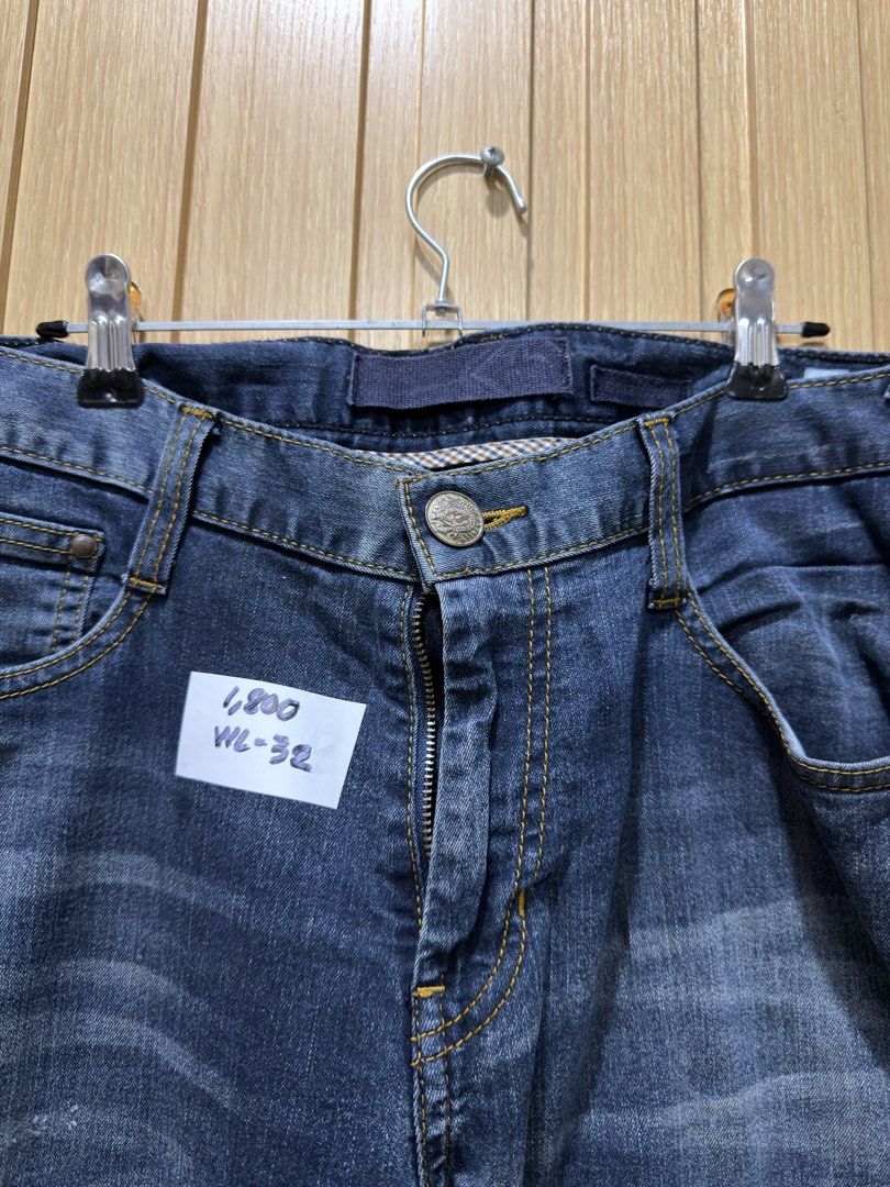 Evisu Dark Wash Denim Jeans Size 32 (Category: Jeans) located in Bacoor. Submitted by preloved_with_love_ (Listing ID 1467253519, Image 2). Description: - Brand: Evisu - Style: Dark wash denim jeans with regular fit - Size: Waist 32 - Details: Iconic painted seagull logo on back pockets, button fly with branded hardware, and unique geometric printed inner lining - Condition: Ready to wear, classic street style staple.